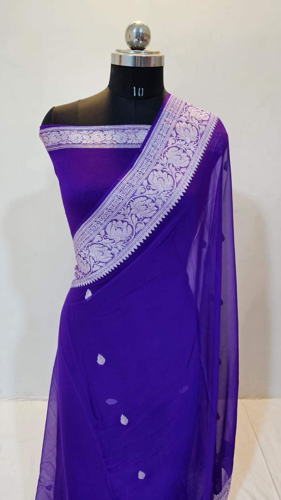 "The Glow of Purple" Banarasi Pure Chiffon saree with the intricate lotus (kamal) motifs woven beautifully into the border, paired with the richness of zari.